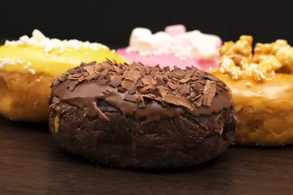 Fresh baked assorted donuts  — ストック写真